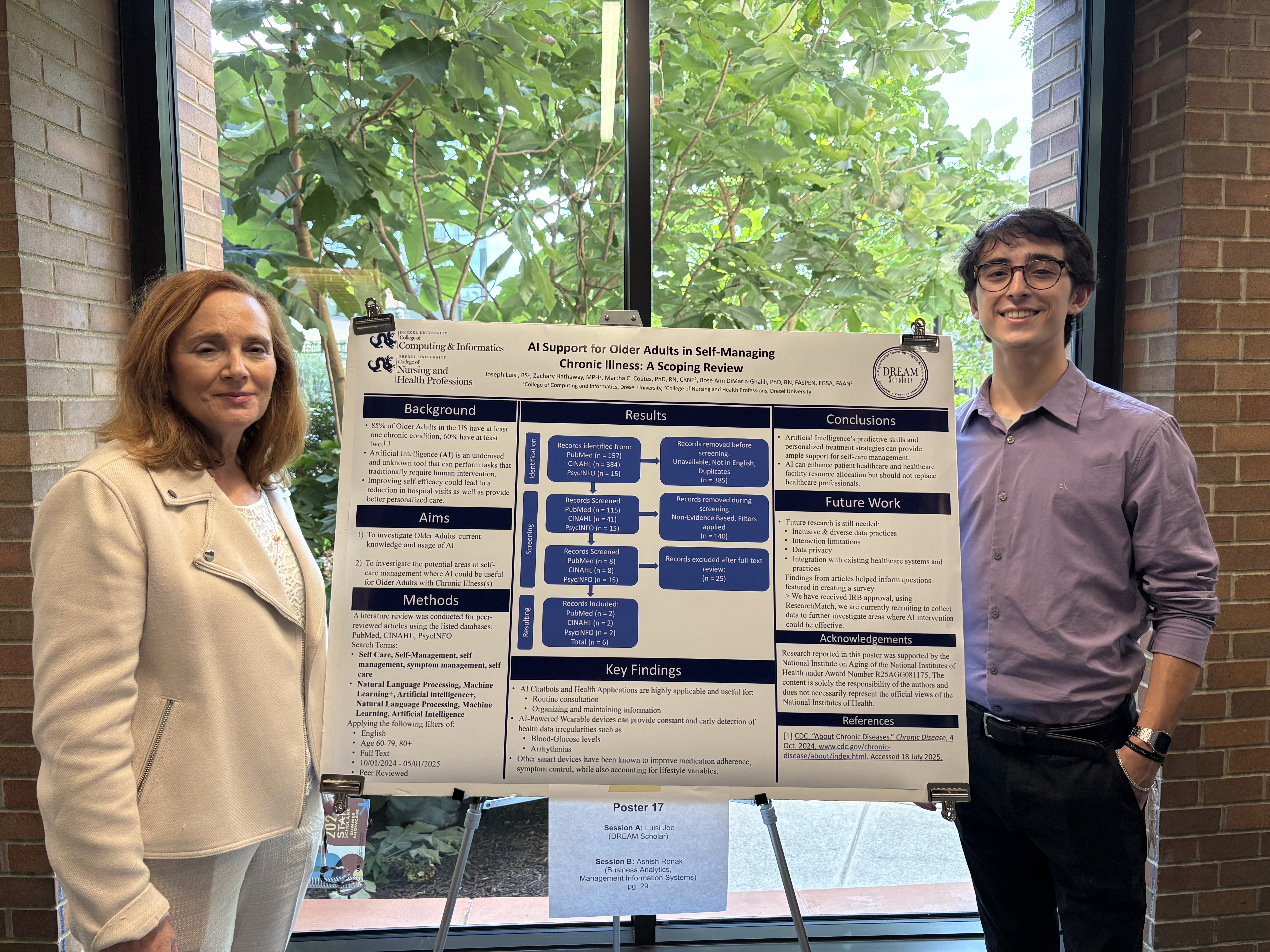 DREAM Scholar Joseph Luisi standing with Rose Ann DiMaria-Ghalili at presentation poster 
